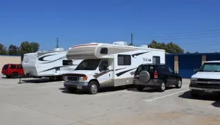 RV and SUV parked in vehicle storage parking spaces