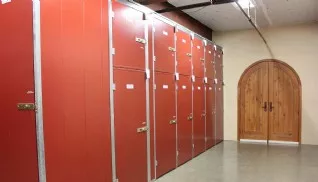 Various size wine storage lockers near wine cellar entrance door